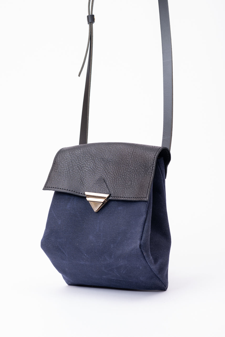 Triangular handbag TRIANGOLO model from the Variable Geometry collection by VEINAGE, handmade in Montreal Canada