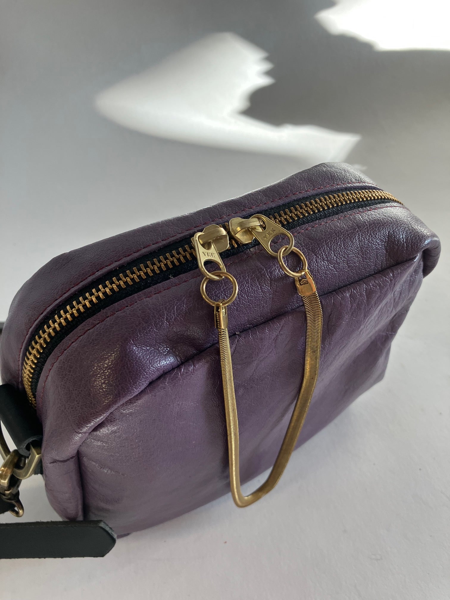 SAMPLE Leather crossbody bag and brass charm orchid color