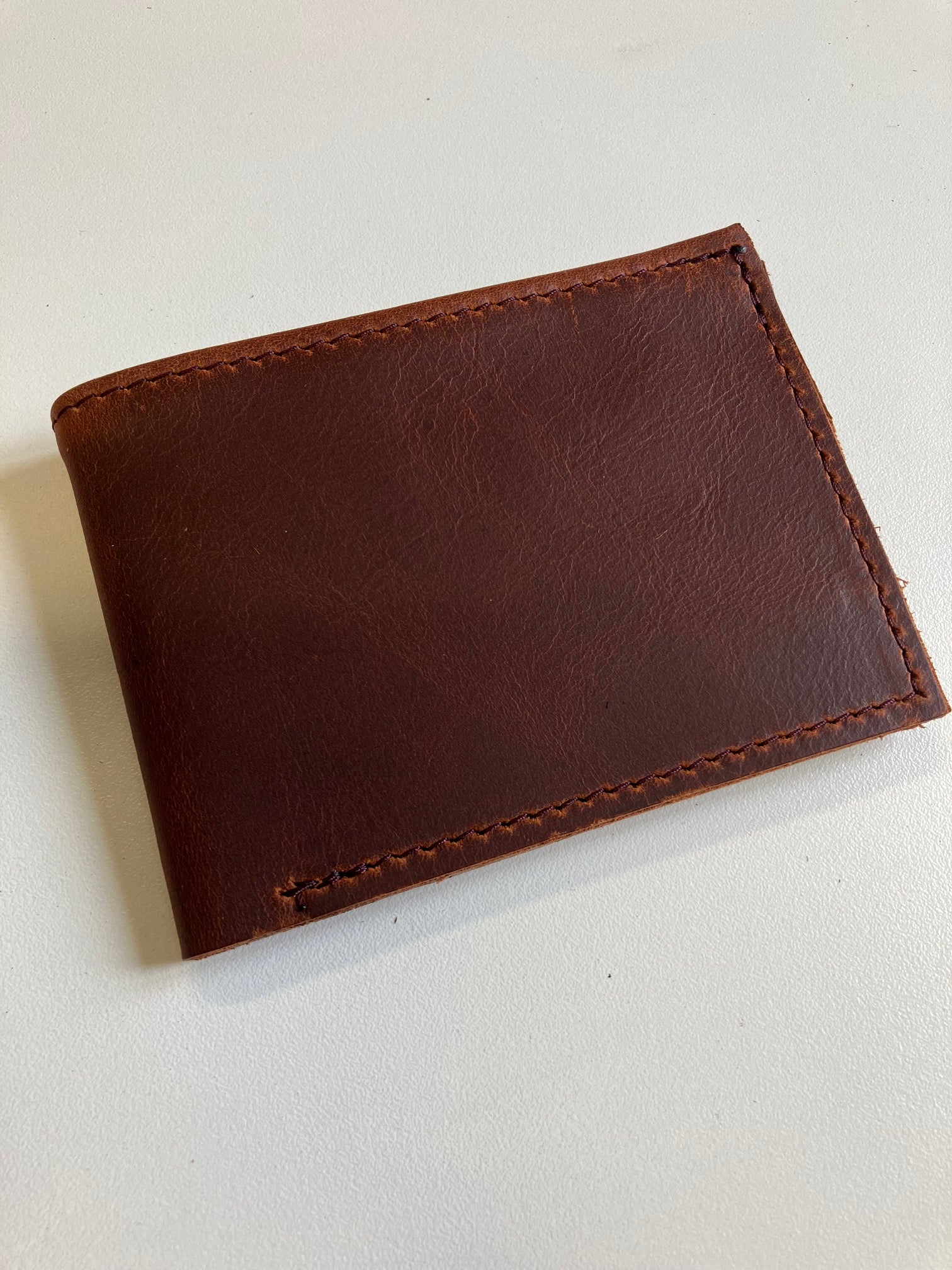 SAMPLE. Minimalist bifold cognac brown leather wallet. handmade in Canada