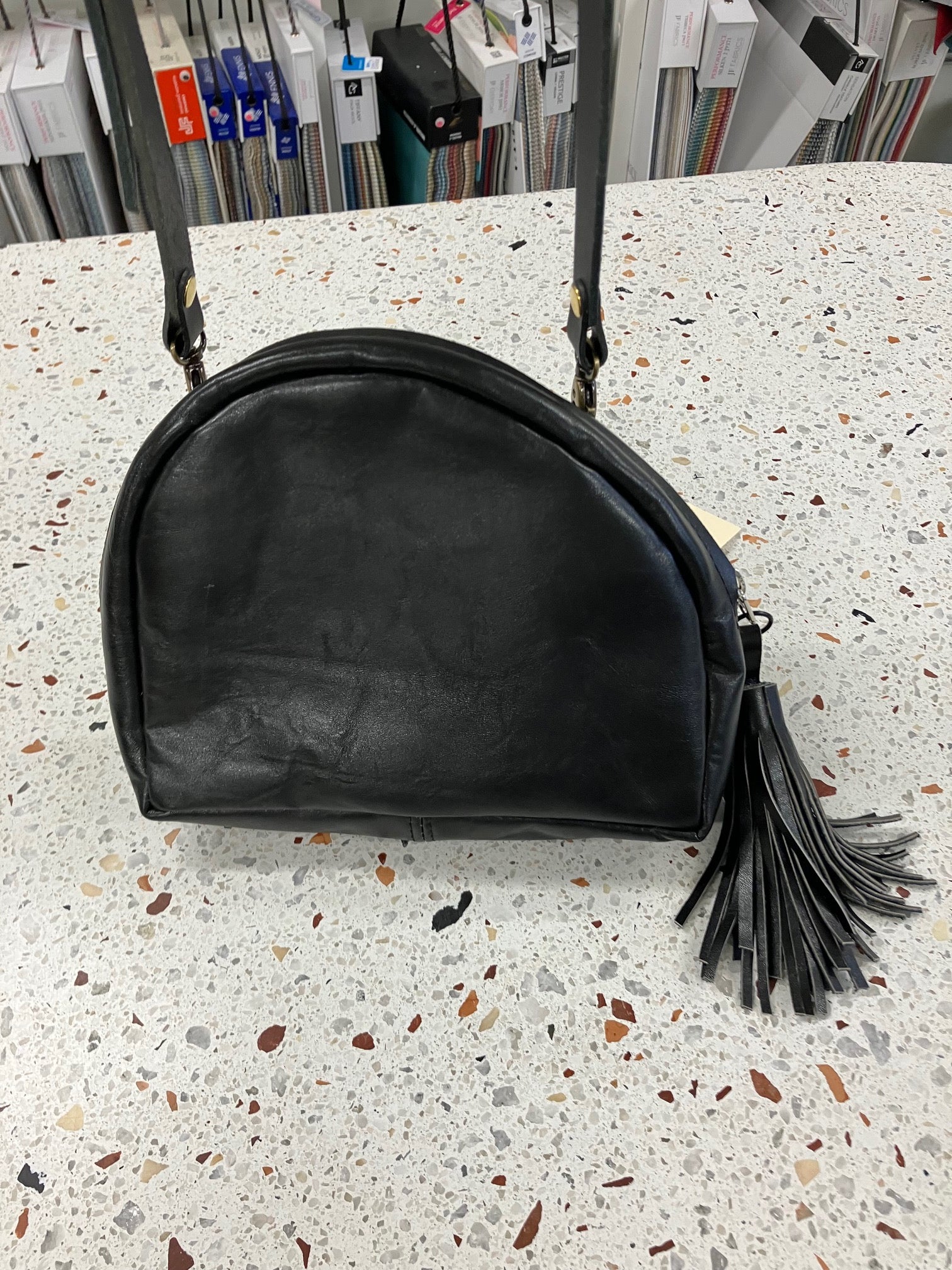 SAMPLE Leather shoulder bag with charm MERINGUE model