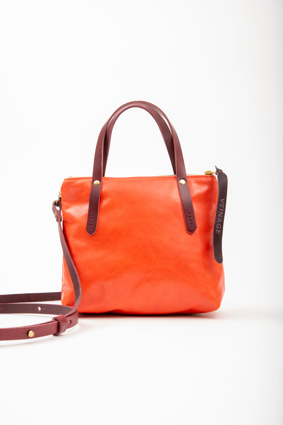 Leather handbag with crossbody strap PAPINEAU model – Veinage