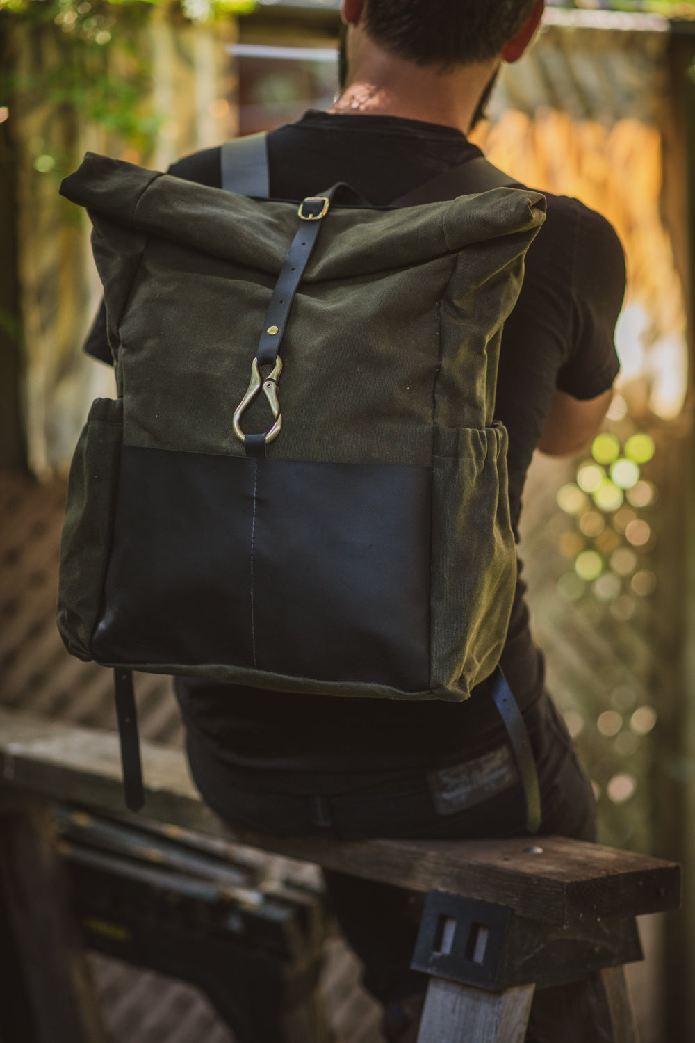 Veinage De Lorimier black leather and army green waxed canvas roll top backpack, handmade in Montreal Canada