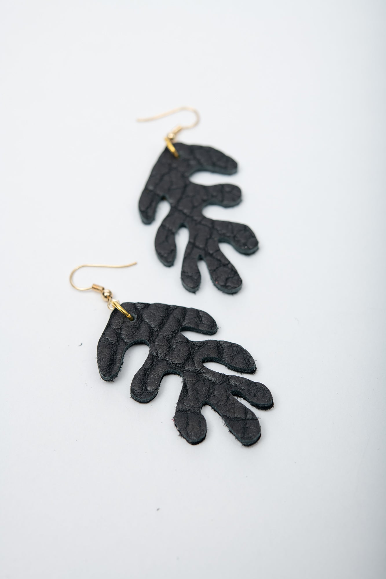 Handmade organic shaped leather earrings CORAIL model by Veinage, Montreal, Canada
