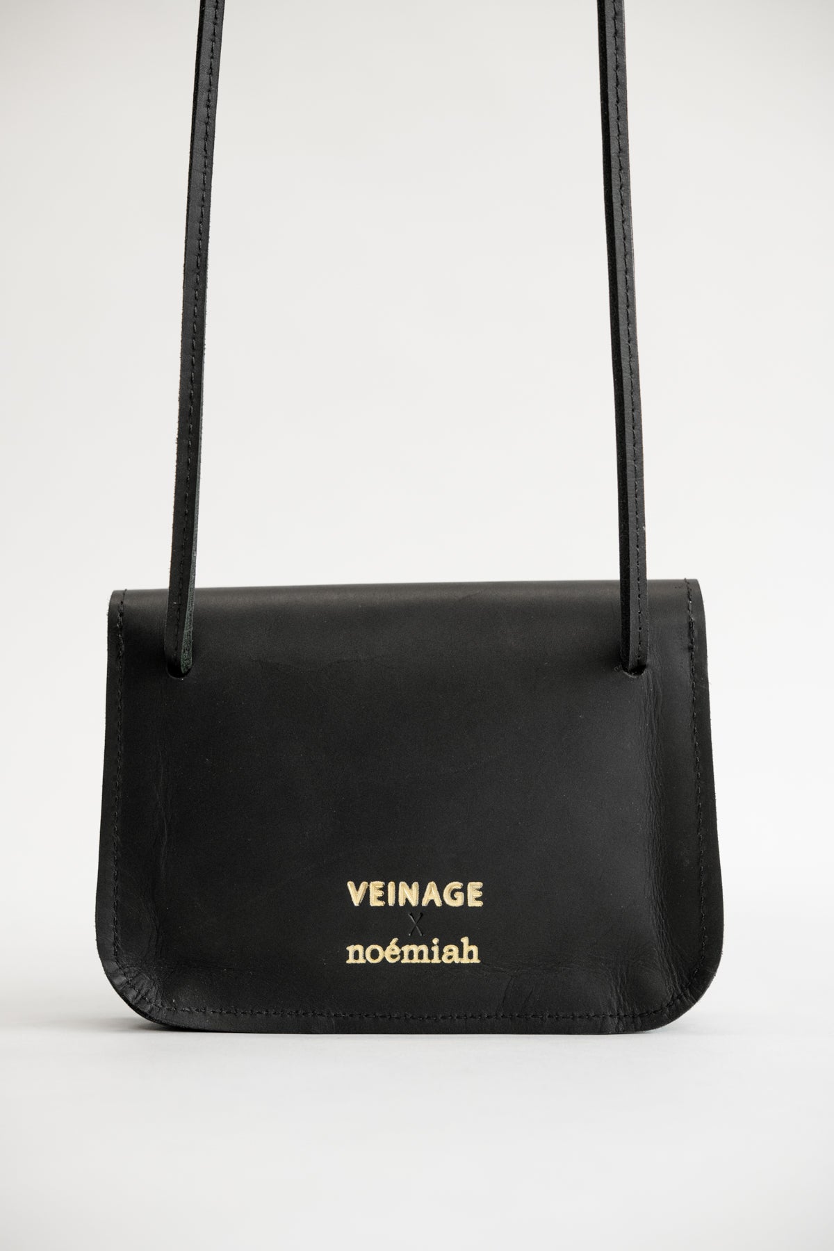 Small leather bag with shoulder strap and scalloped flap VEINAGE x Noémiah