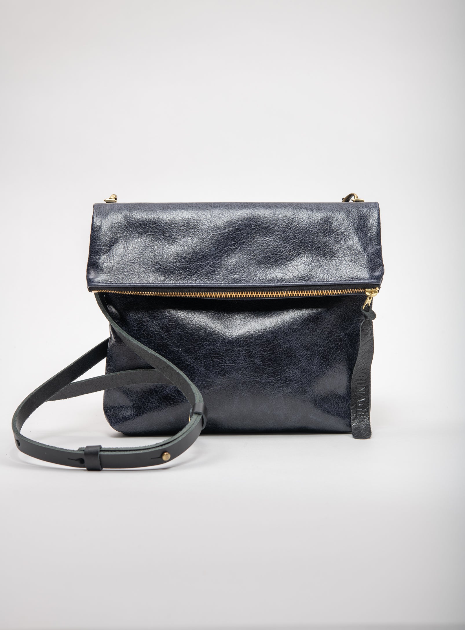 Veinage Bordeaux black leather clutch bag with crossbody strap, handmade in Montreal with upcycled materials